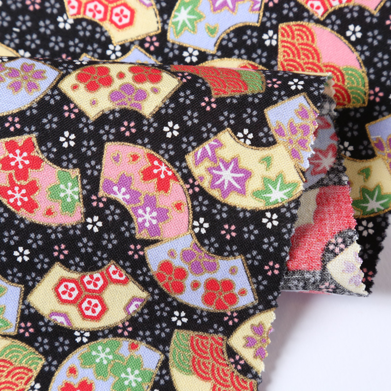 和風柄 民芸シリーズ 2000-83 生地に花柄や彩り豊かな扇文や小桜模様が描かれております / Japanese Pattern Folk Art Series 2000-83 Floral patterns, colorful fan patterns, and small cherry blossom patterns are drawn on the fabric.