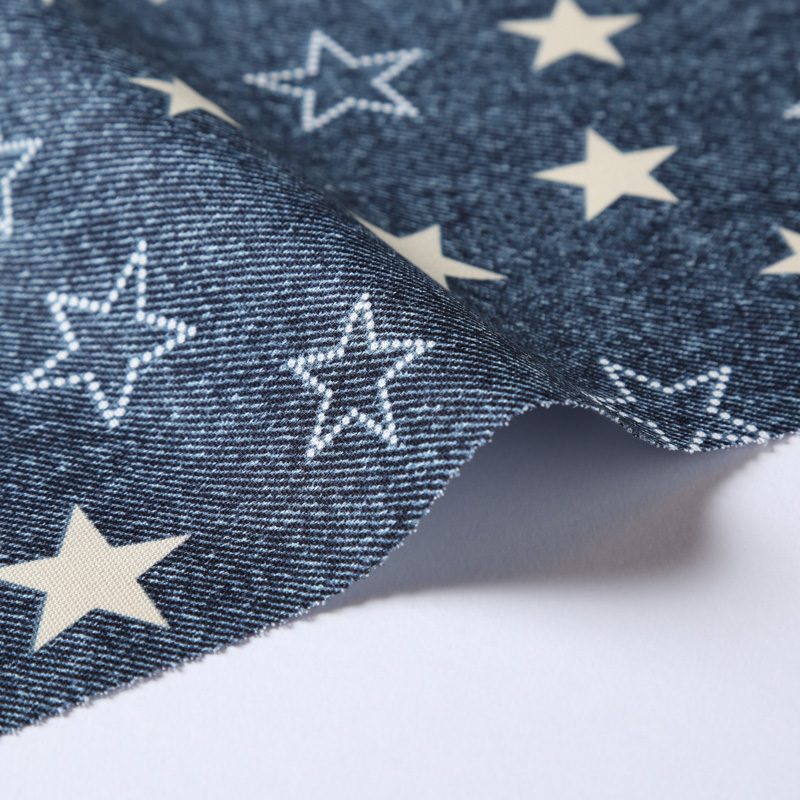 デニム調プリント 4900-4 オックス生地に星柄が描かれています / Denim-like print 4900-4 A star pattern  is drawn on the Oxford cloth.